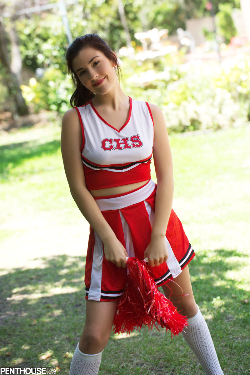 Cheerleader Solo - A cute cheerleader stripping outdoors from Randy